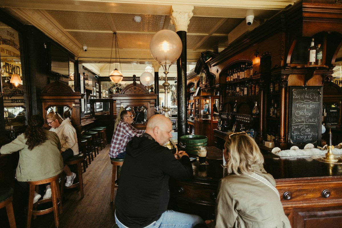 People enjoying drinks in a traditional pub (illustrative photo)