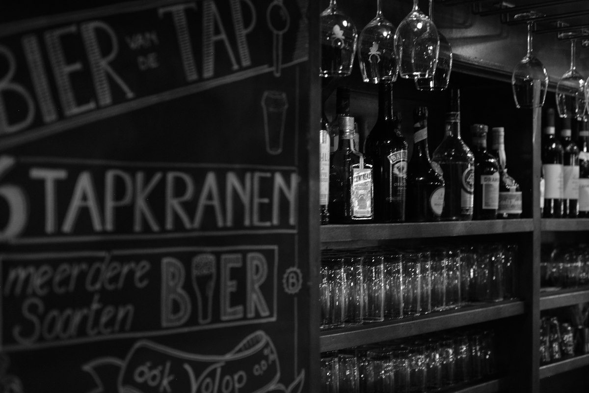 Beer taps and shelves inside a bar (illustrative photo)